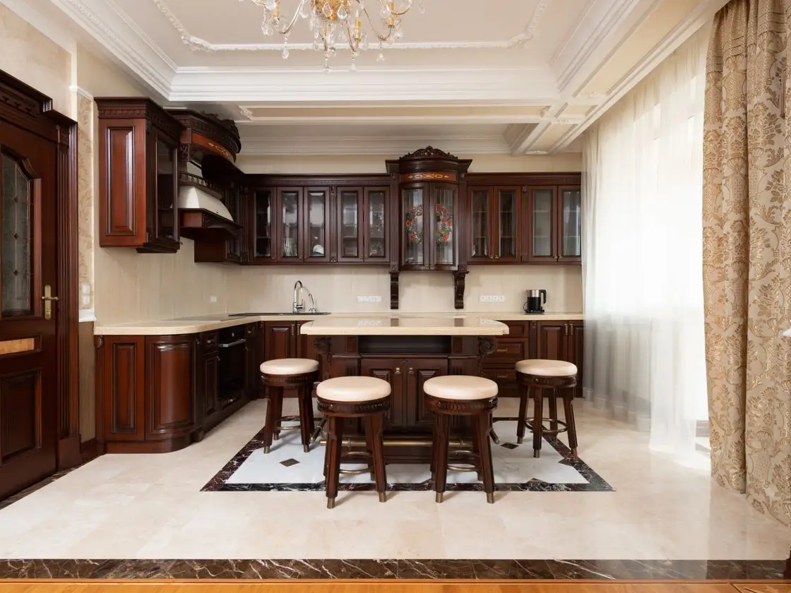 A finished made-to-measure kitchen in a period Surrey home, with hand-built timber cabinetry, aged-brass handles and a stone island